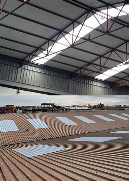 Interior y exterior de nave industrial con lucernarios instalados en cubierta metálica para mejorar la luz natural